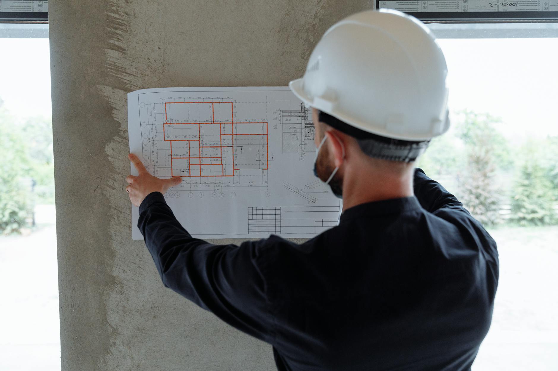 Professional reviewing building blueprints